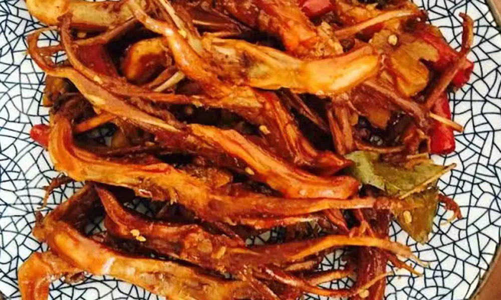 Spicy flavorful duck tongues with rich seasoning at Gourmet Duck 绝味鸭霸王，a Chinese Restaurant in Chicago