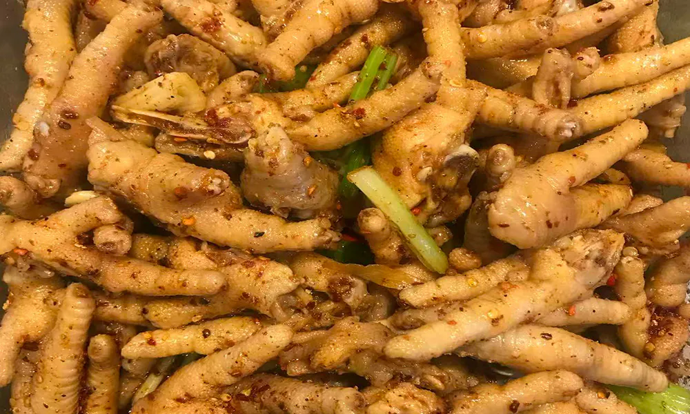 Tingly spicy chicken feet with bold seasoning at Gourmet Duck 绝味鸭霸王，a Chinese Restaurant in Chicago